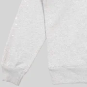 Close-up view of the sleeve on the grey Sp5der OG Web V2 Knicks Home Hoodie featuring small star graphic details.