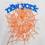 Close-up view of the Sp5der OG Web V2 Knicks Home Hoodie in grey, showcasing the vibrant orange web and New York graphic.