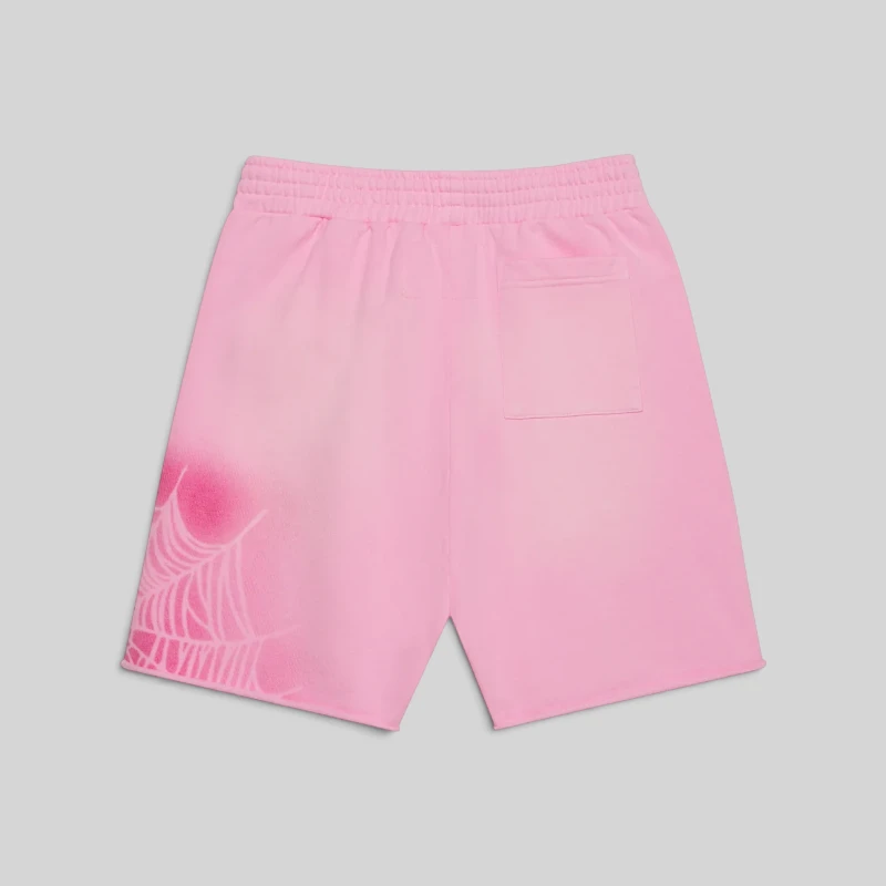 Back view of Sp5der OG Web V2 Spray Zip Sweatshorts in Light Pink, featuring a 13oz cotton fleece and spray web design.