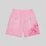Front view of the Sp5der OG Web V2 Spray Sweatshort in Light Pink with rhinestone text and web graphic design.