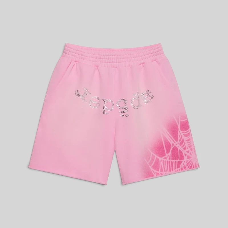 Front view of the Sp5der OG Web V2 Spray Sweatshort in Light Pink with rhinestone text and web graphic design.