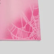 Close-up view of the Sp5der OG Web V2 Spray Zip shorts in light pink showing the detailed cobweb graphic pattern.
