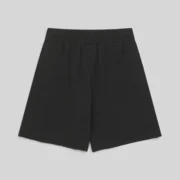Back view of black Sp5der OG Web V2 heavyweight cotton fleece sweatshorts with raw hem and back patch pocket.