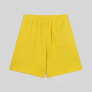 Back view of the vibrant yellow Sp5der OG Web V2 sweatshorts featuring an elastic waistband and a single back pocket.