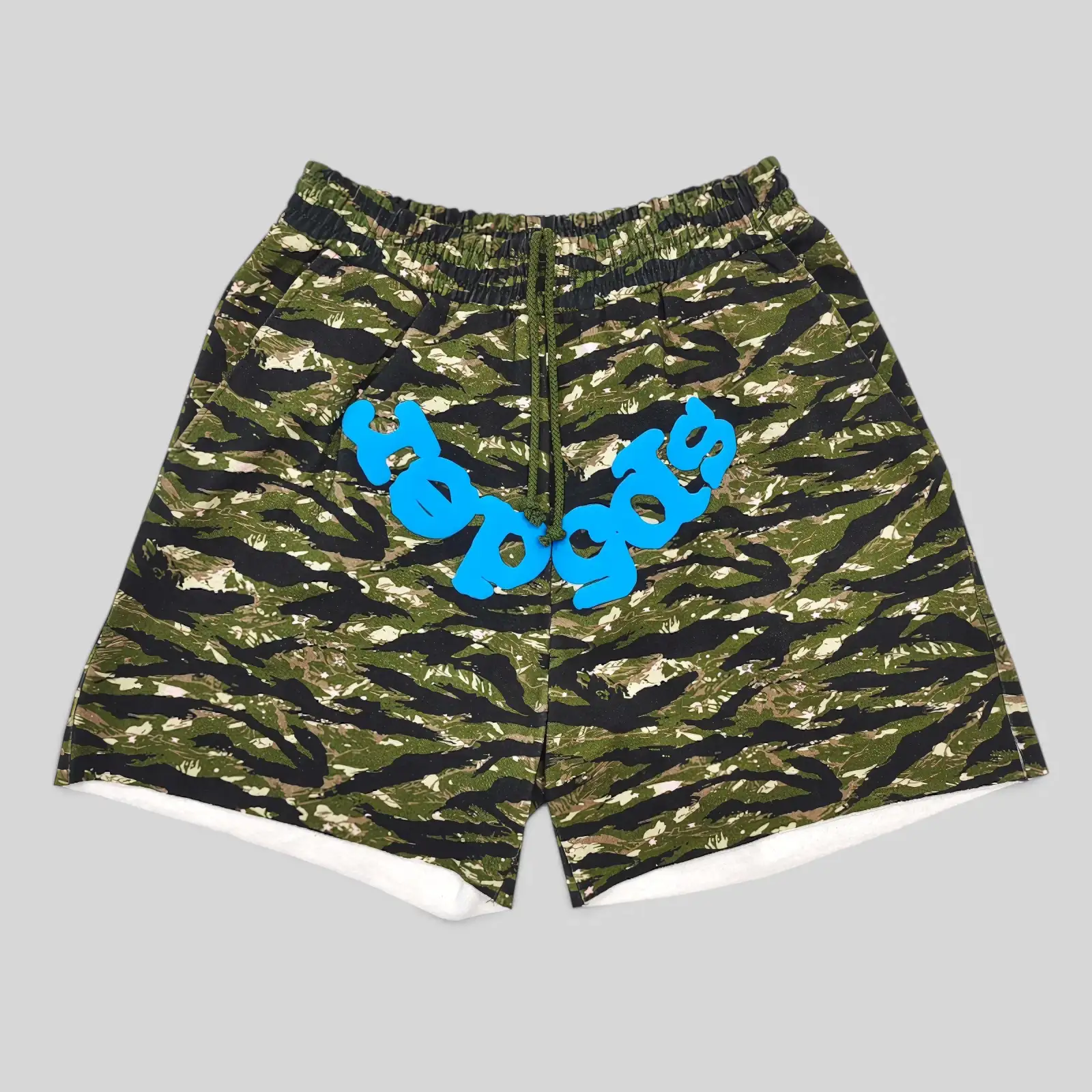 Sp5der OG Web V2 Tiger Camo Sweatshorts featuring a bold green camo pattern and signature blue graphic branding front view.