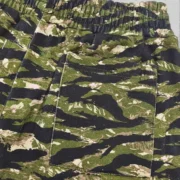 Close-up view of the Sp5der OG Web V2 Tiger Camo Sweatshorts showing the detailed premium 13oz cotton fleece fabric.