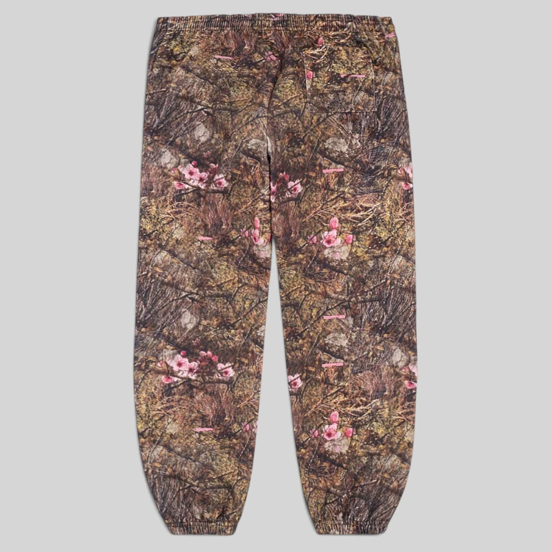 Back view of the Sp5der OG Web sweatpants featuring a camouflage Real Tree print pattern with floral accents.