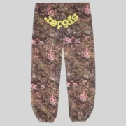 Front view of Sp5der OG Web sweatpants in a brown Real Tree camo pattern with pink flowers and yellow Sp5der branding.
