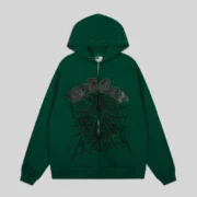 Front view of the green Sp5der OG Web Studded Zip Hoodie featuring a black spider web print and studded details.