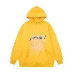 Front view of the Sp5der P*NK collaboration hoodie in a vibrant mustard-yellow colorway with graphic web print.