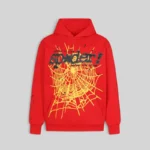 Front view of the heavy-duty red Sp5der P*NK V2 hoodie featuring a bold yellow web graphic and black Sp5der logo print.