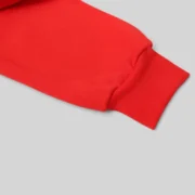 Close-up view of the premium red heavyweight cotton fleece fabric from the Sp5der P*NK V2 Hoodie streetwear collection.