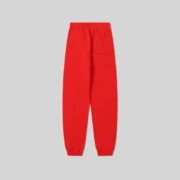 Back view of the Sp5der P*NK V2 Sweatpants in red, featuring premium heavyweight fleece and a comfortable elastic fit.