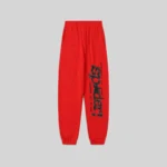 Front view of the Sp5der P*NK V2 sweatpants in red featuring black puff print logo and star detailing.
