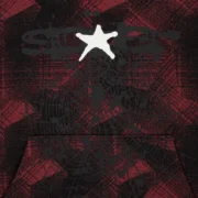 Close-up of the Sp5der Plaid Splatt Hoodie in Black featuring the signature web graphic and iconic star logo print.