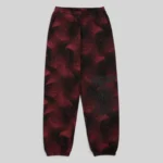 Front view of the Sp5der Plaid Splatt Sweatpants in Black featuring a unique red and black patterned graphic design.