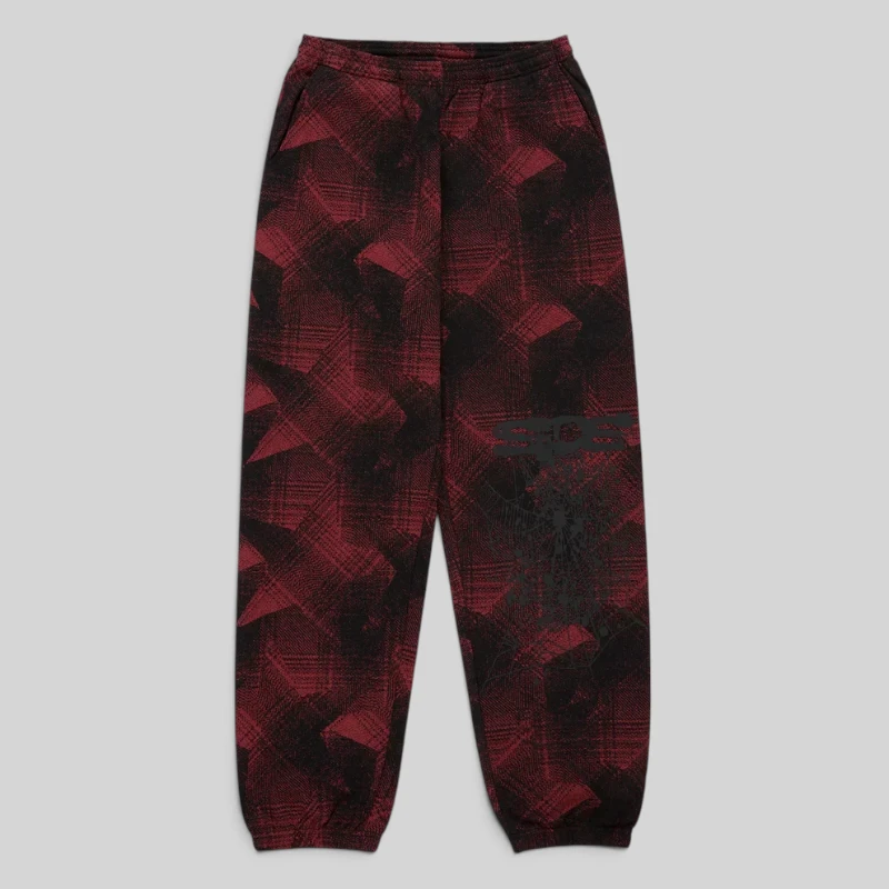 Front view of the Sp5der Plaid Splatt Sweatpants in Black featuring a unique red and black patterned graphic design.