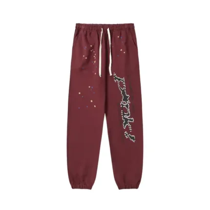 Front view of the Sp5der P*nk sweatpants in brown featuring a distressed print and a comfortable elasticated waistband.