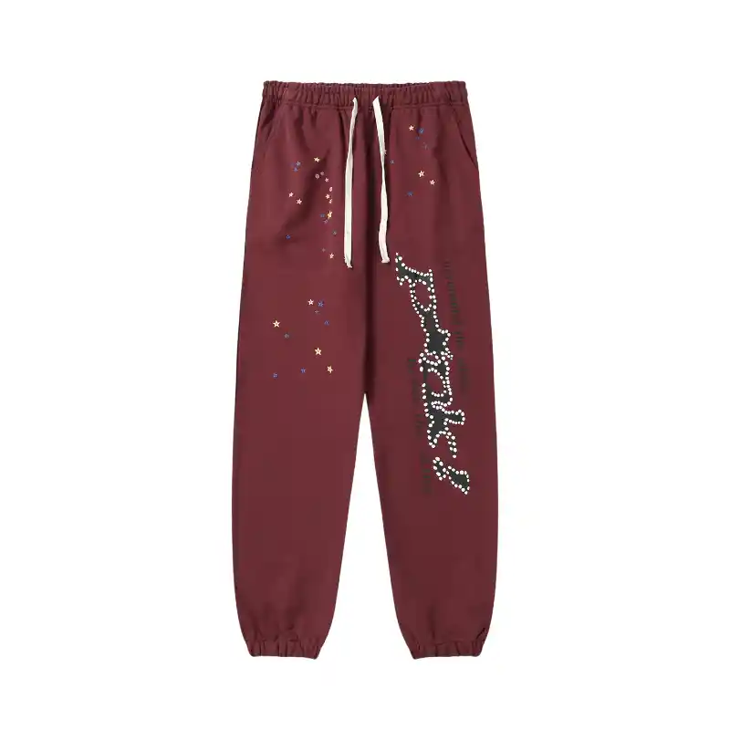 Front view of the Sp5der P*nk sweatpants in brown featuring a distressed print and a comfortable elasticated waistband.