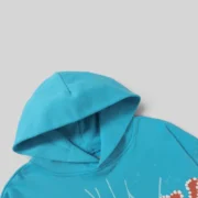 Closeup of the Sp5der Punk V2 Hoodie in Sky Blue, showcasing the high-quality 13oz cotton fleece and iconic graphic detail.