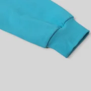 Close-up view of the durable rib knit cuff on the Sky Blue Sp5der Punk V2 Hoodie made from 13oz cotton fleece fabric.