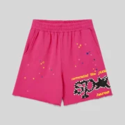 Front view of pink Sp5der Punk V2 sweatshorts featuring signature star graphics and bold text on 100% cotton fleece.