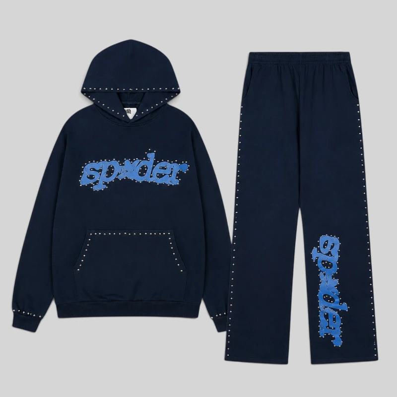Front view of the Sp5der Punk V3 studded tracksuit in dark blue, featuring signature branding and hardware details.