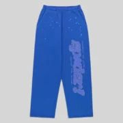 Sp5der Rhinestone Punk V2 sweatpants in blue featuring rhinestone-lined lettering and a scattered star print design.