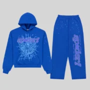 Front view of the blue Sp5der Rhinestone Punk V2 tracksuit set featuring graphic web prints and iced-out star details.