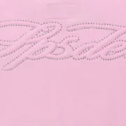 Close-up view of the Sp5der Light Pink Rhinestone Script Zip Hoodie featuring detailed sparkling crystal embellishments.