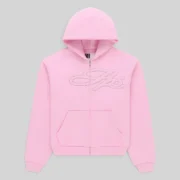 Sp5der light pink zip hoodie featuring a front rhinestone script logo made from heavyweight 13oz cotton fleece fabric.