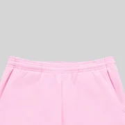 Close-up of the elasticized waist detail on the light pink Sp5der Rhinestone Script wide-leg cotton fleece sweatpants.