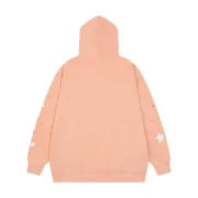 Back view of the Sp5der SP5 Bellini Hoodie in a soft baby-pink color featuring star graphic detailing on the sleeves.