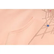 Close up view of the Sp5der SP5 Bellini Hoodie in baby-pink featuring the iconic graphic and premium fabric details.