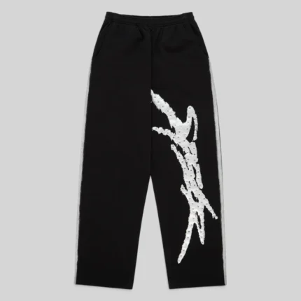 Front view of Sp5der Screaming Eagle sweatpants in black featuring iconic rhinestone logo and sprayed side stripe detail.