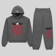 Sp5der Splat Punk Tracksuit in Slate, featuring a graphic hoodie and matching joggers with red web print and star accents.