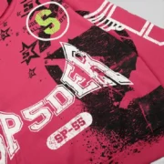 Close-up view of the front graphic print on the pink Sp5der Stencil Hoodie from the exclusive FW25 streetwear collection.