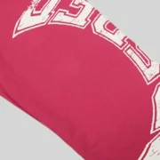 Close-up view of the Sp5der Stencil Sweatpants in Pink showcasing the detailed white graphic print on the fabric.
