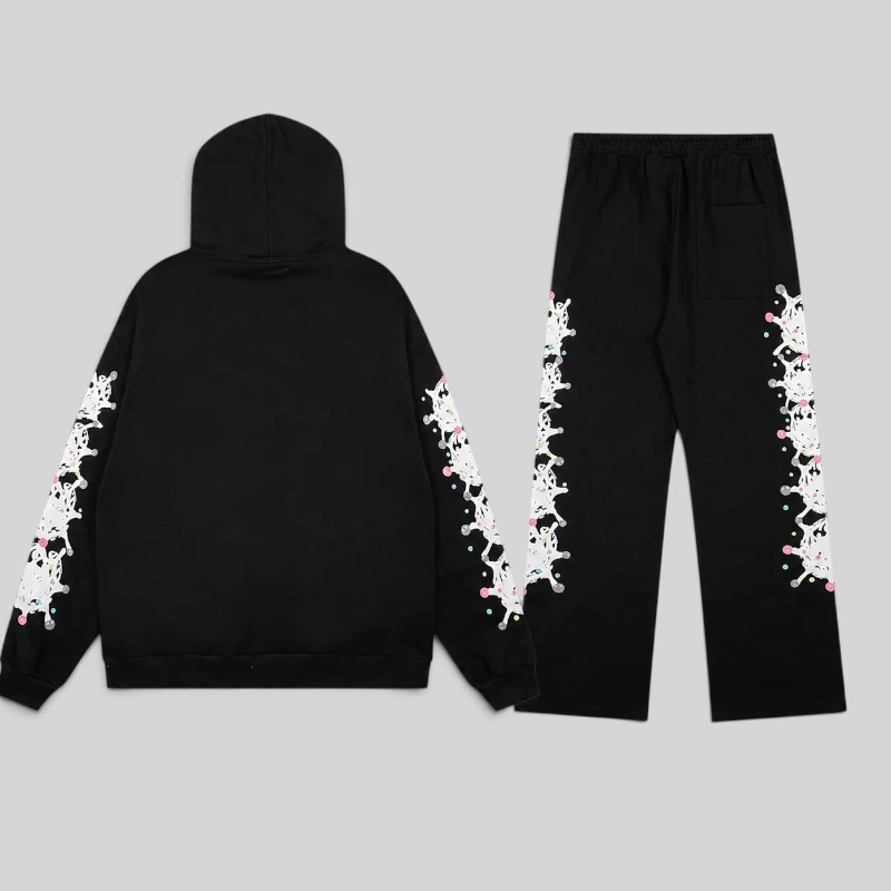 Back view of the premium Sp5der Stone Tracksuit in black featuring the iconic graphic web print and cotton fleece fabric
