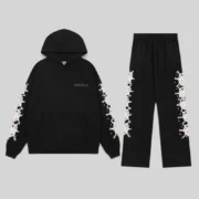 Front view of the Sp5der Stone Tracksuit in Black, a premium 13oz cotton fleece streetwear set with web graphics.