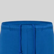 Close-up view of the elastic waistband and drawstrings on the Sp5der Beluga TC Blue heavyweight cotton fleece sweatpants.