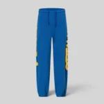 Front view of blue Sp5der Beluga sweatpants featuring signature yellow branding on the sides, made from 13oz cotton fleece.