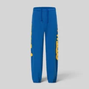 Front view of blue Sp5der Beluga sweatpants featuring signature yellow branding on the sides, made from 13oz cotton fleece.