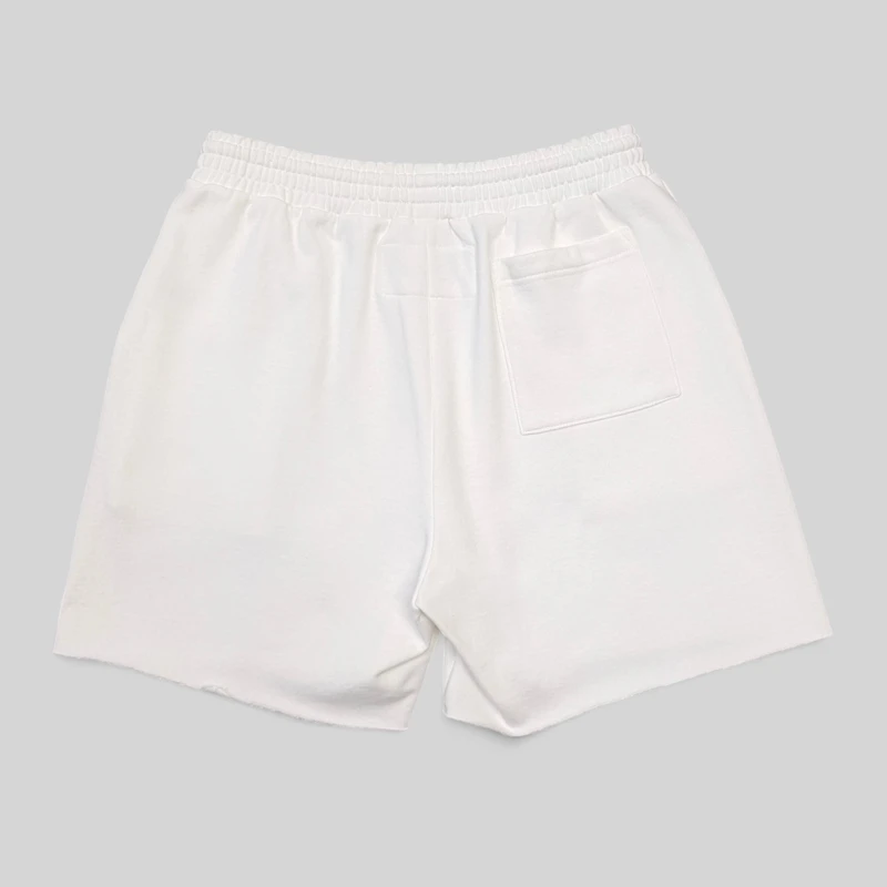 Sp5der T&F Sweatshorts in White, shown from the back, featuring premium 13oz cotton fleece for streetwear comfort.