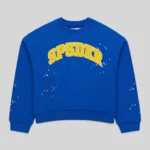 Front view of the blue Sp5der Varsity Web Crewneck featuring yellow signature branding and scattered star graphics.