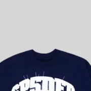 Close-up view of the ribbed neckline on the navy blue Sp5der Varsity Web Crewneck with signature spiderweb graphic.