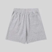 Back view of Sp5der Vvs Sweatshorts in Heather Grey featuring tonal rhinestone detailing and a back pocket design.