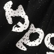 Close-up view of the black Sp5der Vvs sweatshorts featuring signature iced-out tonal rhinestone detailing on fabric.
