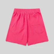 Pink Sp5der Vvs Sweatshorts shown from the back, featuring 100% cotton fleece and tonal rhinestone detailing.