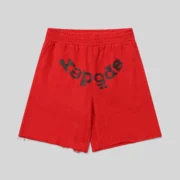 Front view of red Sp5der Vvs sweatshorts featuring rhinestone detailing and signature Sp5der branding in cotton fleece.